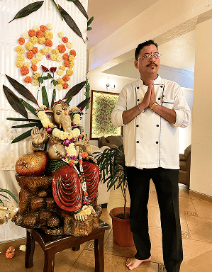 Chef at Neelams The Grand with a festive display